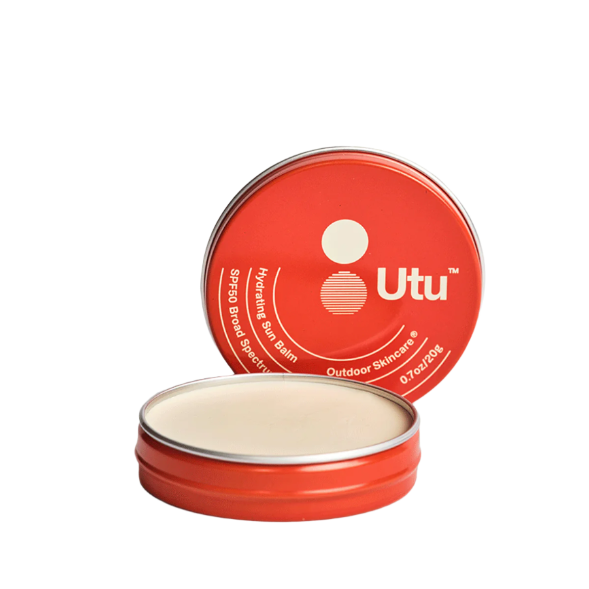 Red tin of Utu outdoor skincare balm on a beige background